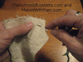 Demonstrating running stitch.