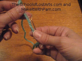 Pinch the thread tail and needle