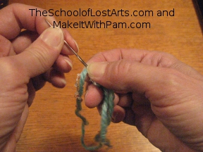 Pull needle and thread through.