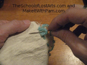 Pass needle through loop.