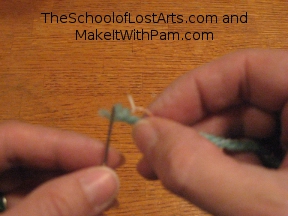 Pushing thread through the eye of the needle